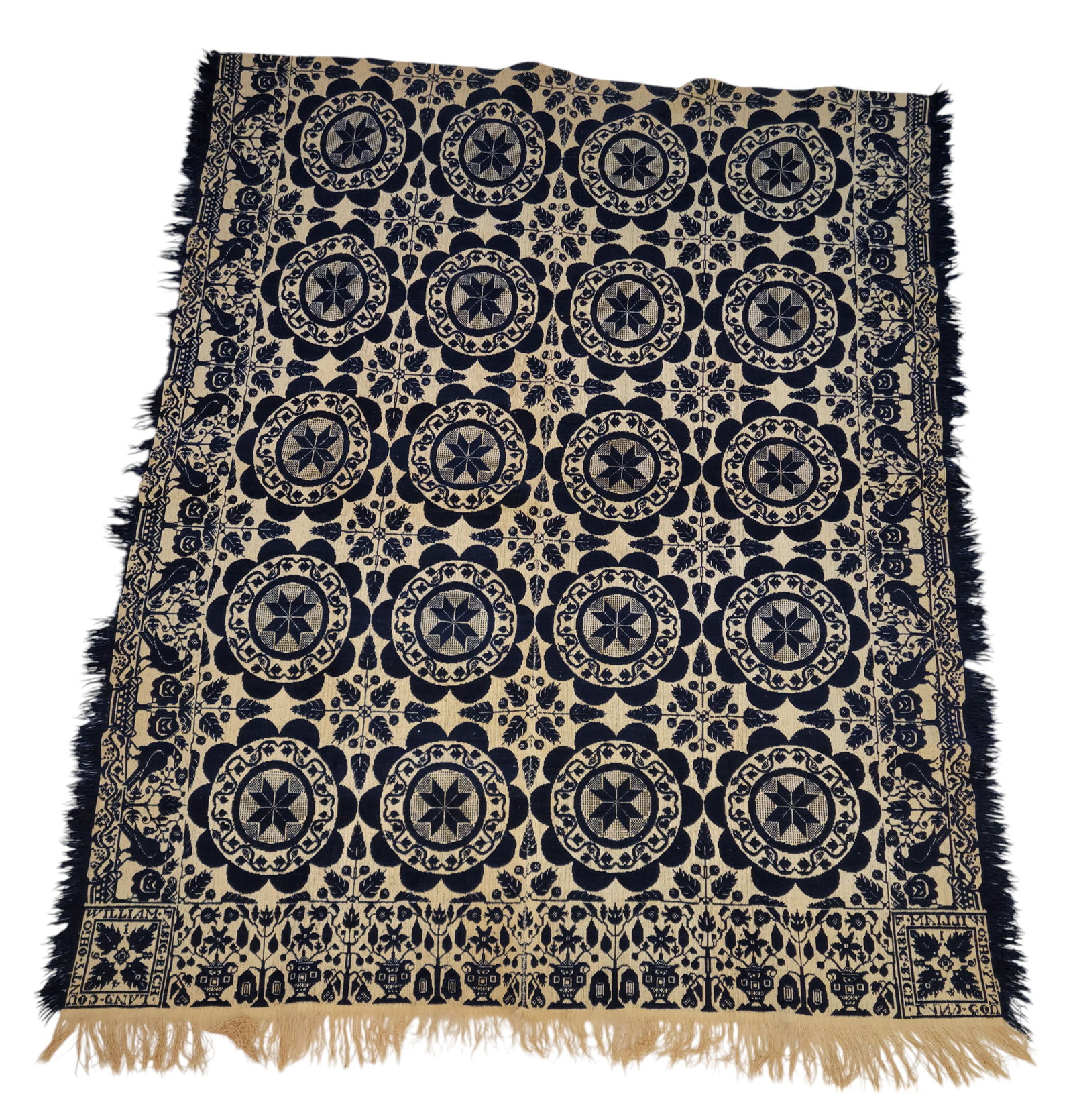 RICHLAND COUNTY, OHIO COVERLET: William Fasig, 1846. Blue and white, with star wreaths, and borders with birds and urns. 90" by 72".