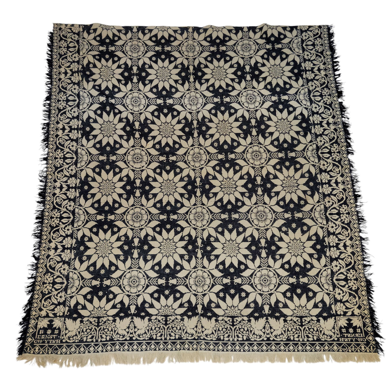 JACQUARD COVERLET: Possibly Ohio, unidentified weaver, for Ernest Gwytsch, 1846. Blue and white, with flowers, and a vining floral border. 90" by 79".