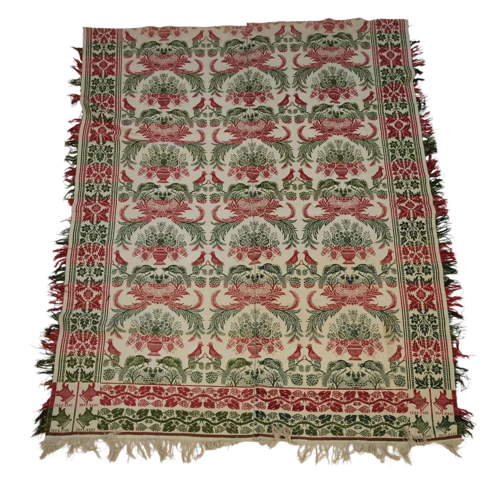 JACQUARD COVERLET: Possibly Ohio, 1856. Green, red, and white, with large urns and birds of paradise, and with unusual corner blocks with flower pots, the date, and "MAD." 85" by 70".