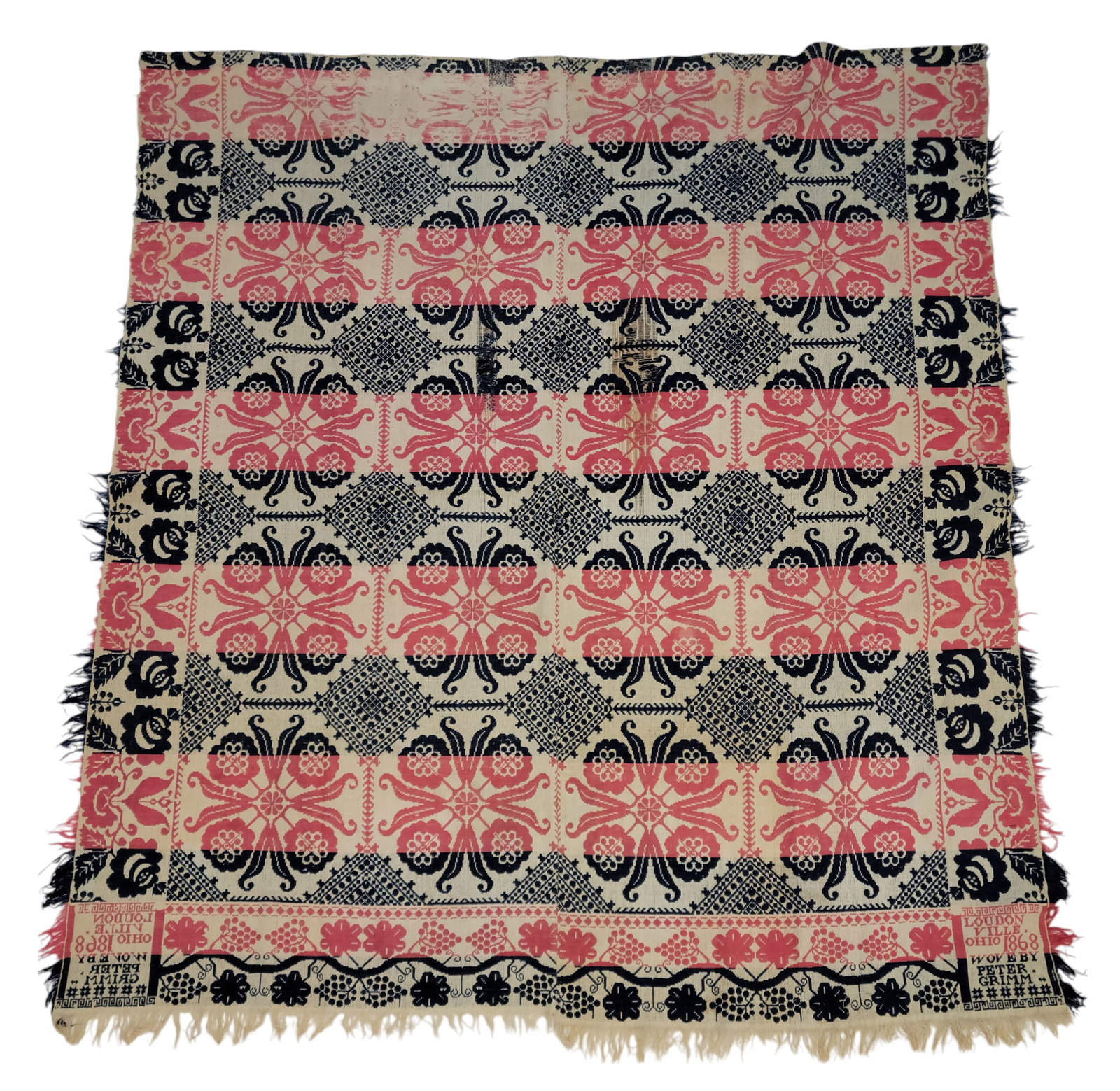 LOUDONVILLE, OHIO COVERLET: Peter Grimm, Ashland County, 1868. Dark blue, light red, and white, with unusual floral medallions, and borders with flowers and grapes. 79" by 70".