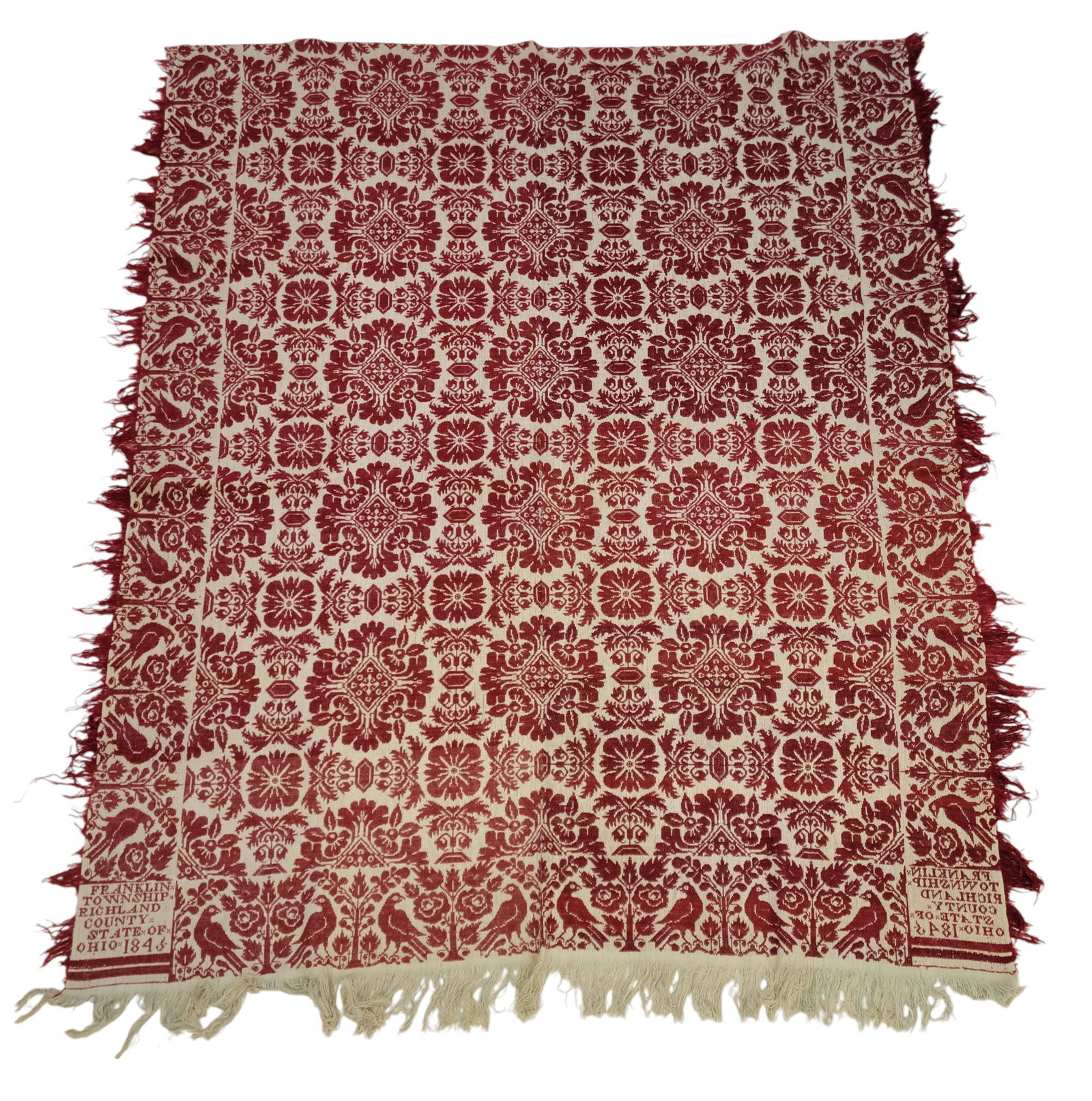 RICHLAND COUNTY, OHIO COVERLET: Unidentified weaver, Franklin Township, Richland County, State of Ohio, 1845. Red and white with centerfield of floral medallions, and a border of birds and flowers, 95" by 77".