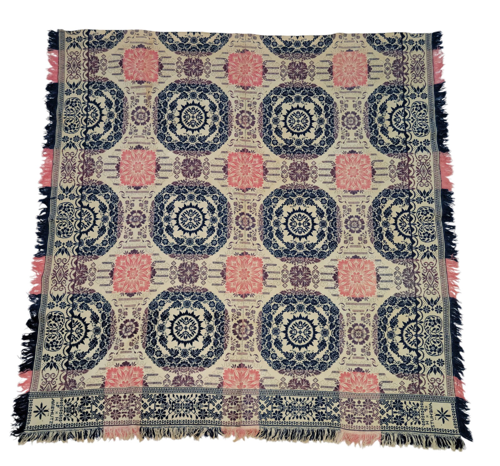 CARROLL COUNTY, OHIO COVERLET: Philip H. Anshutz, probably Carroll County, Ohio, mid-19th century. Two piece coverlet with pink, purple, and blue figured and fancy floral medallion design, floral borders, corner blocks signed "P H 