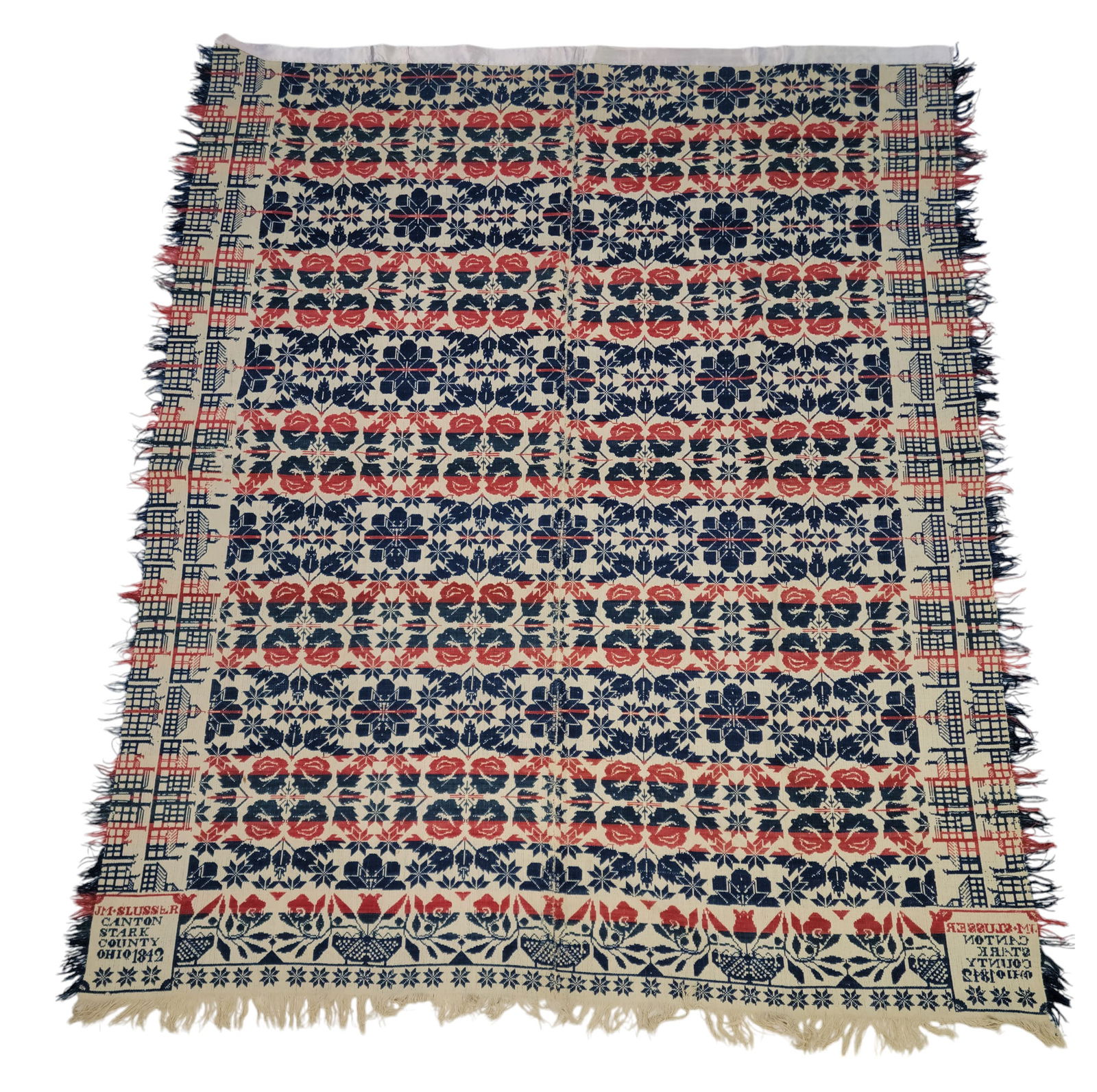 STARK COUNTY, OHIO COVERLET: Jacob M. Slusser, Canton, Stark County, Ohio, 1842. Red, white, and blue centerfield with floral medallions, double side borders of buildings, tulip and basket foot border with lower row of small star