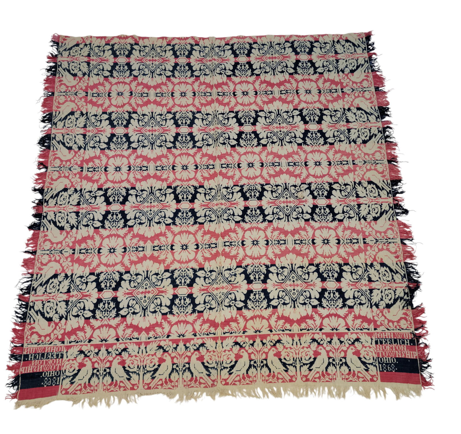 NORTON TOWNSHIP, OHIO COVERLET: John Wunterlich, Norton Township, Summit County, Ohio, 1868. Pink and blue centerfield of floral medallions with a bird and rose border, corner block signed and dated "JOHN. WUNTERLICH. NORTON. TOWNSH
