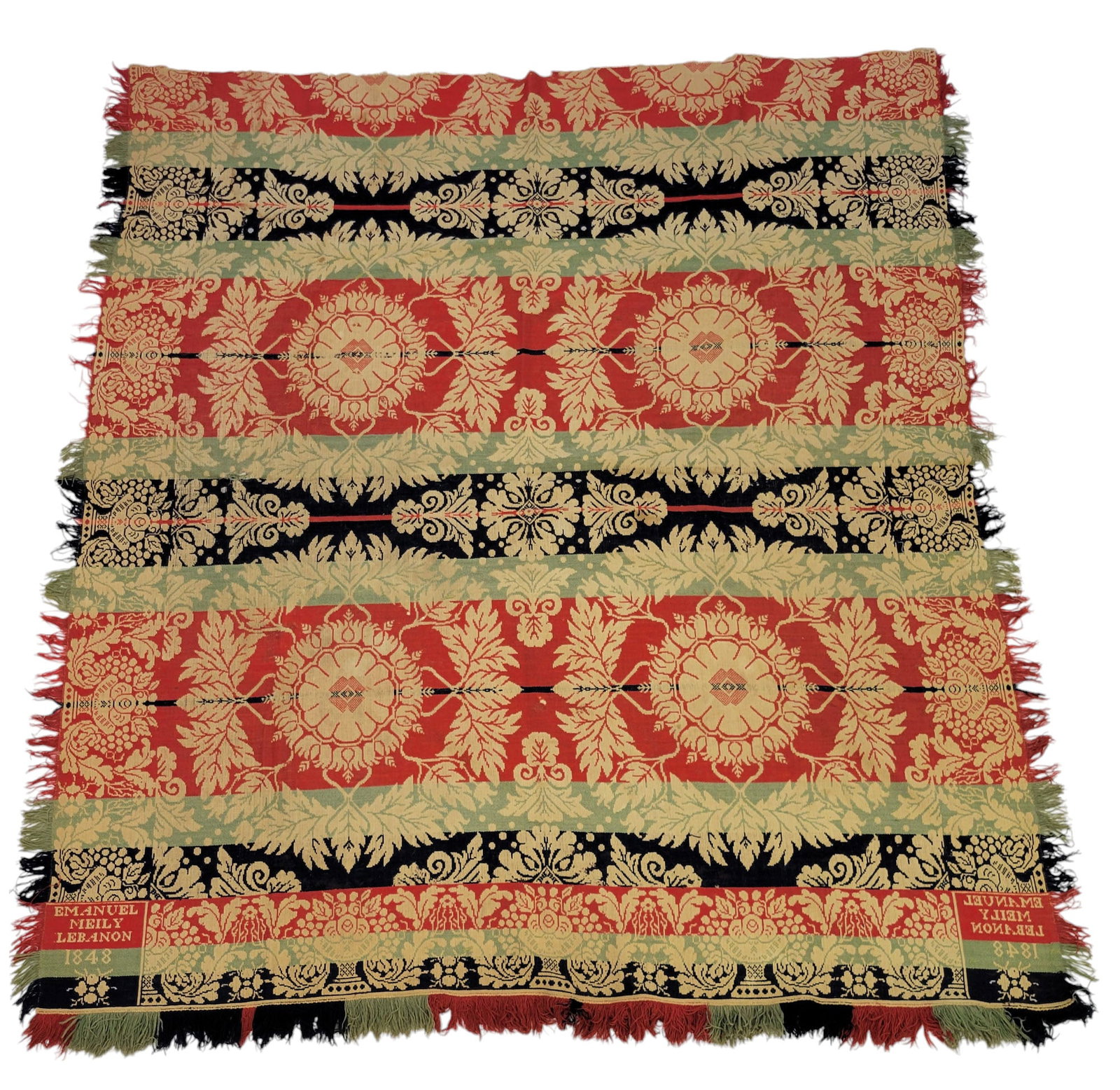 LEBANON, PENNSYLVANIA COVERLET: Emanuel Meily, Lebanon, Pennsylvania, 1848. Seamless, black, light green, red, and white, with large wreaths, and flowers and berries on the borders. 97" by 87".