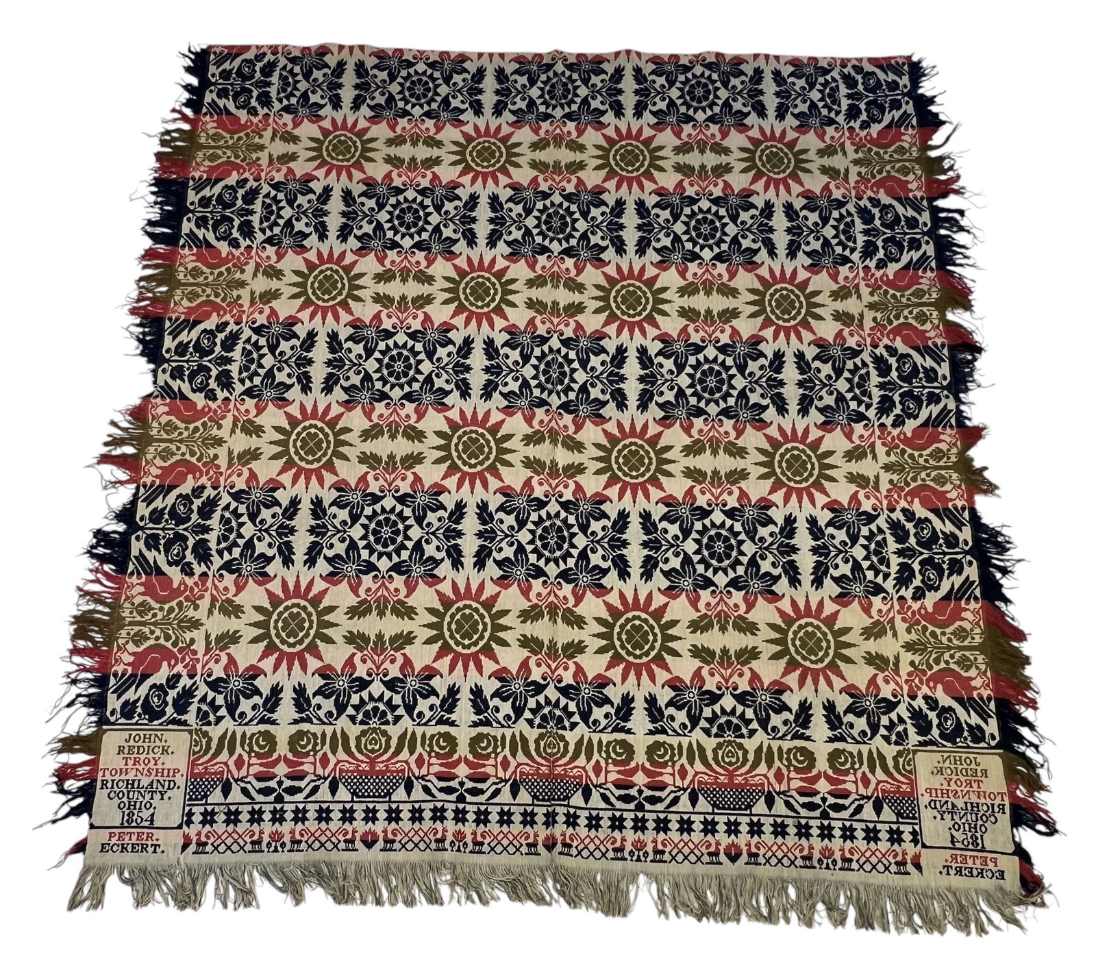 RICHLAND COUNTY, OHIO COVERLET: John Redick for Peter Eckert, Troy Township, 1854. Blue, light red, green, and white, with stars and flowers at center, the borders with birds, flower baskets, and tiny deer. 90" by 84".
