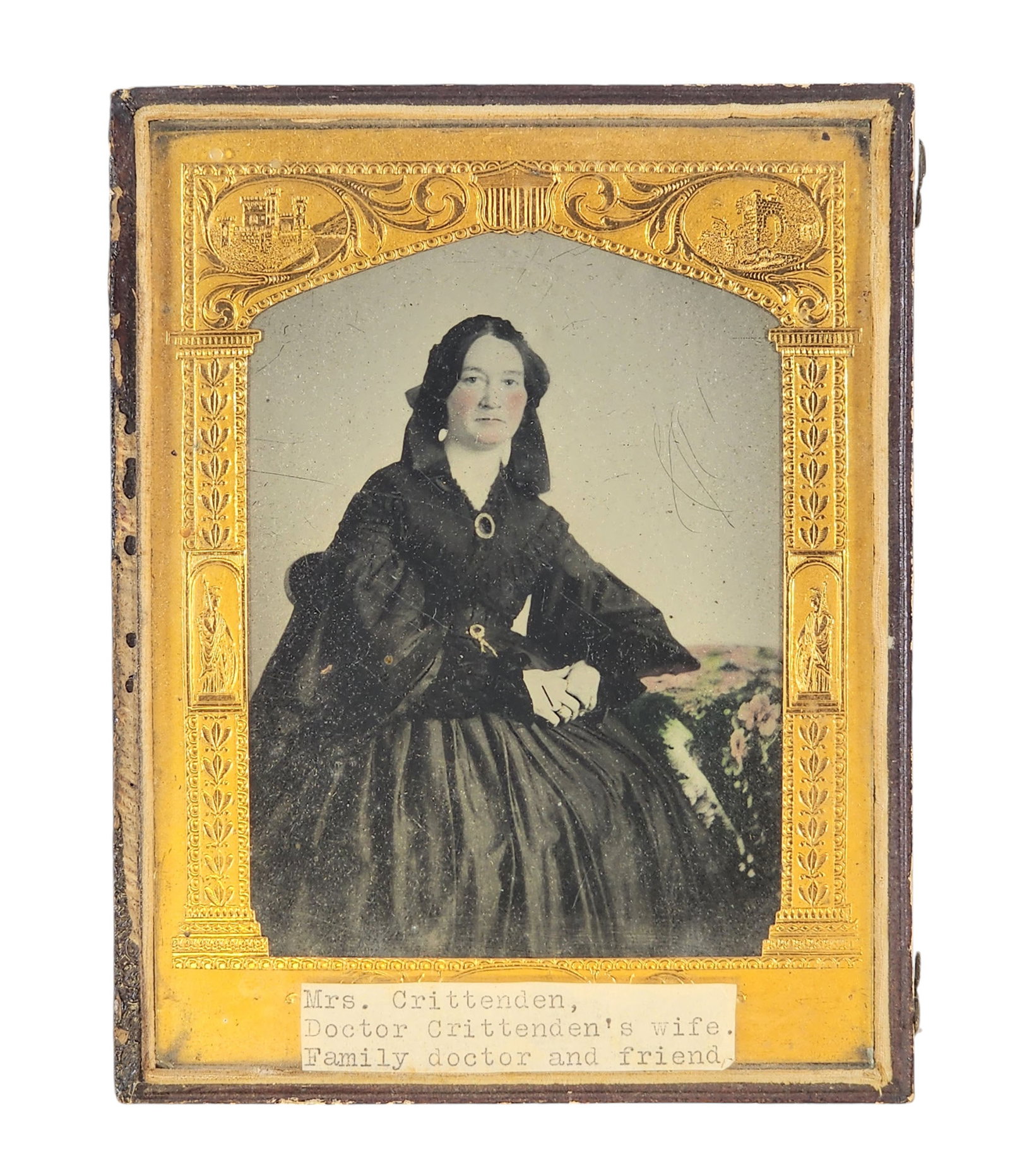 HALF PLATE AMBROTYPE OF A LADY: Mid-19th century. Tinted portrait of a lady in black, identified as the wife of Dr. Crittenden. Pressed leather case.