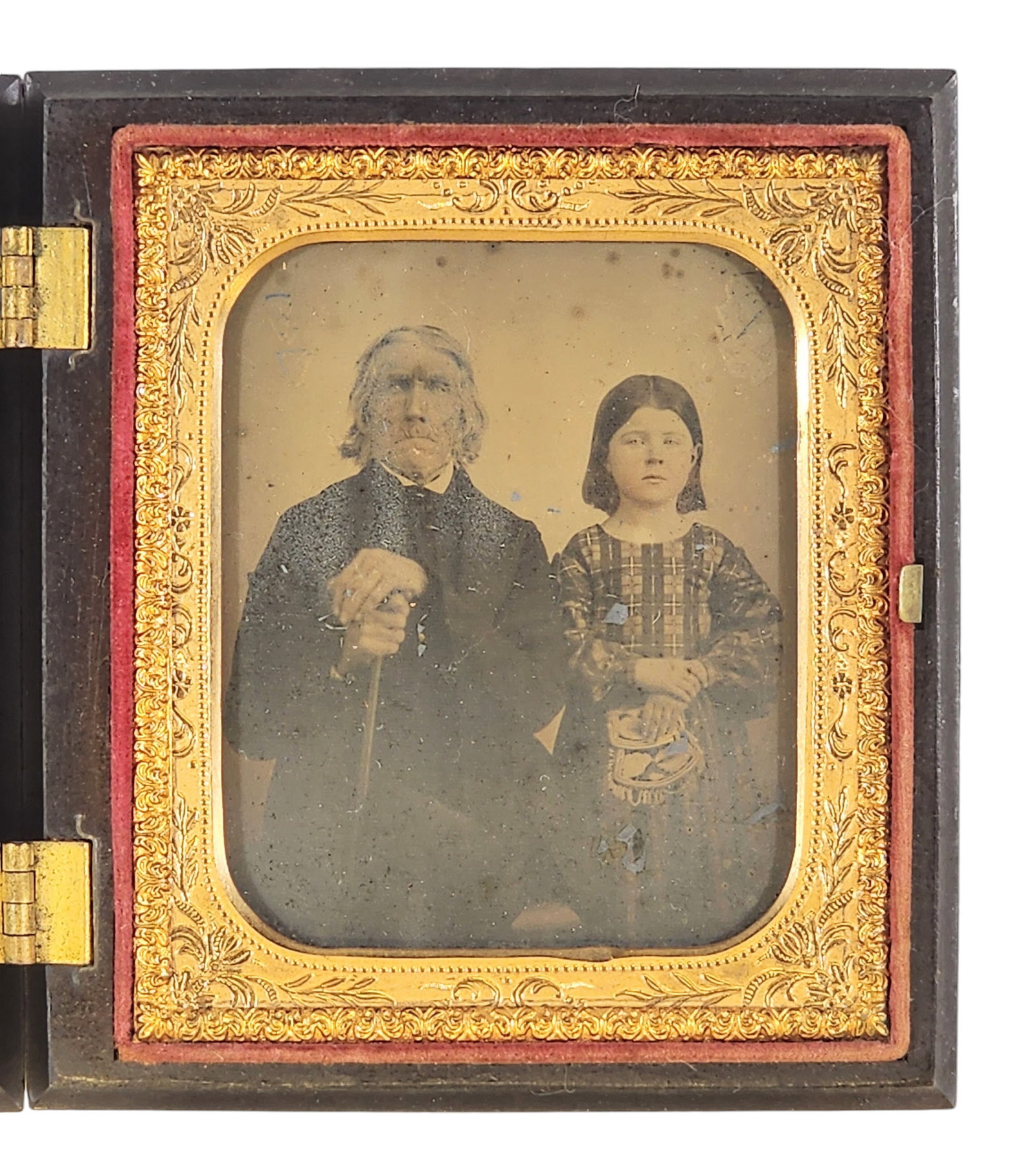 SIZTH PLATE AMBROTYPE OF A FATHER AND DAUGHTER: Mid-19th century. Portrait of an older man and a young girl, and she appears to be holding a Haudenosaunee (Iroquois) beadwork purse. In a Beck's thermoplastic union case.