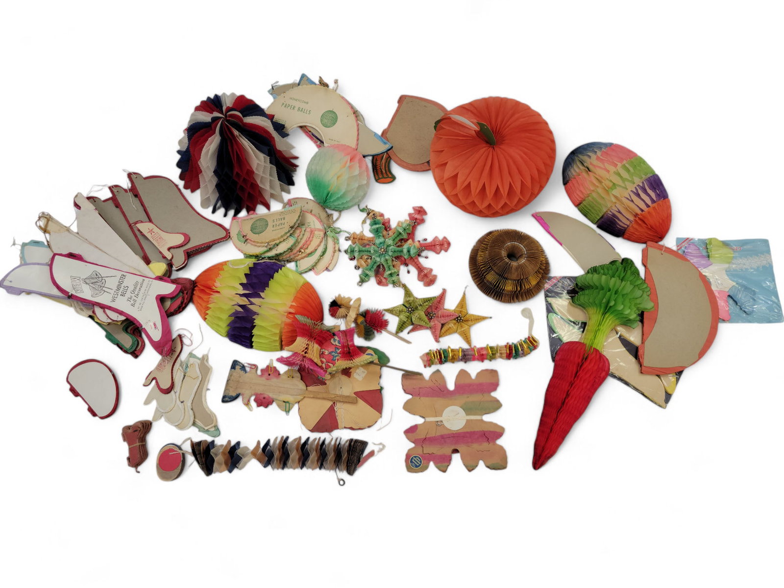 COLLECTION OF VINTAGE HONEYCOMB DECORATIONS: Mid-late 20th century. Includes various holiday (Halloween, Christmas, Easter, July 4th) and other items. While Dr. Gunn is widely known for her expertise in quilts and coverlets, holiday honeycomb is