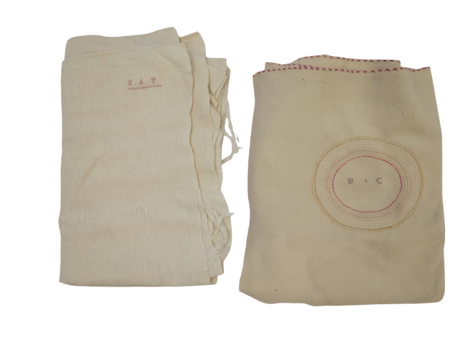 TWO EARLY WOOL BLANKETS: 19th century. One is embroidered "EAT" and the other "BC" in concentric cirlces. 84" by 54" and 68" by 84".