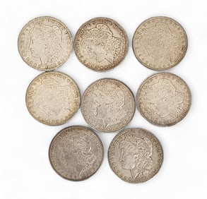 EIGHT MORGAN SILVER DOLLARS