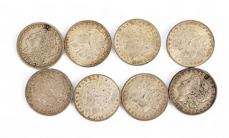 EIGHT MORGAN SILVER DOLLARS