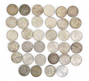 THIRTY-FOUR PEACE SILVER DOLLARS