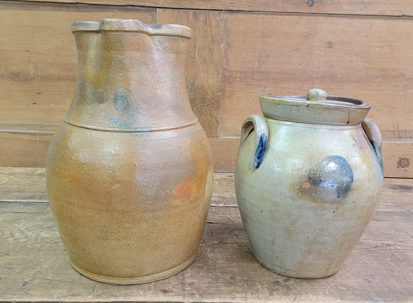 TWO PIECES OF OHIO STONEWARE: Mid-19th century. Includes a one-gallon ovoid jar, unmarked but probably I.M. Mead, Portage County, 9.75" high; together with a two-gallon pitcher, probably Ohio, 13" high. Provenance: private collect