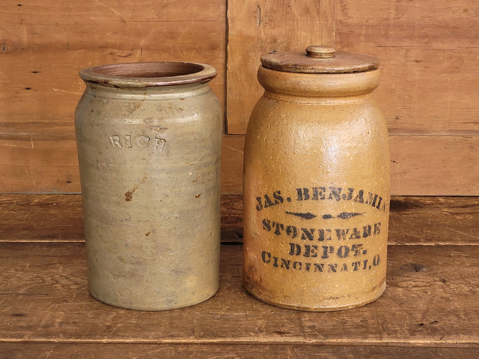 TWO PIECES OF OHIO STONEWARE: Includes a cylindrical jar marked for Prosper Rich, Muskingum County, 1830s, 10" high; togerh with a one-gallon jar with a clear stencil for James Benjamin's Stoneware Depot, Cincinnati, 10" high. Acc