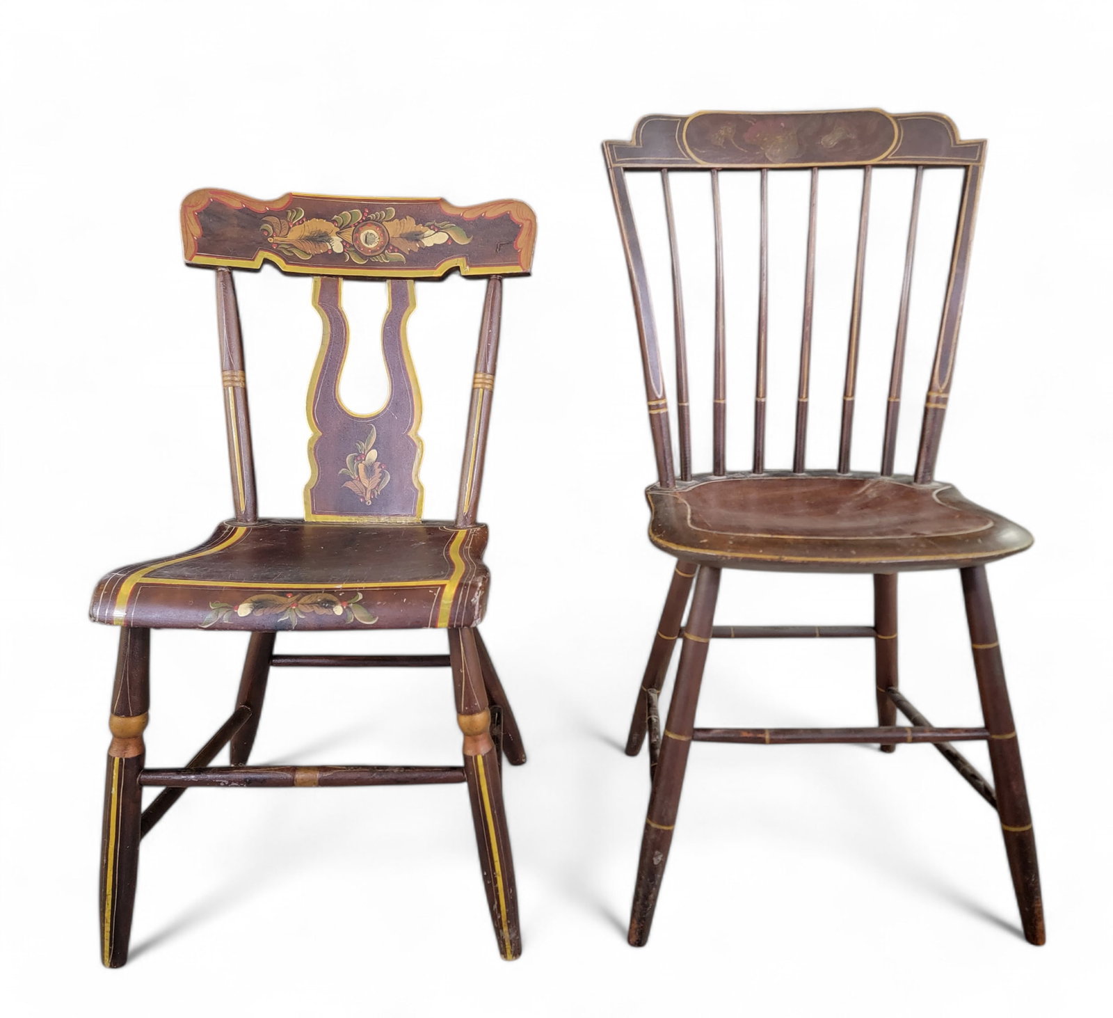 TWO DECORATED CHAIRS: American, 1820-1840, mixed woods. Includes a windsor and a chair with bootjack splat, both with their original painted decoration. 31.5" and 35.5" high. Provenance: private collection.