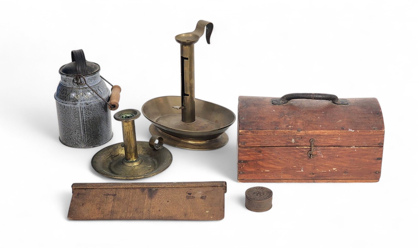 GROUP OF COUNTRY ITEMS: American, 19th-20th century. Includes a dometop box with leather handle, two brass chambersticks, a miniature graniteware milk can, a small "FOR A GOOD GIRL" tin box, and a wooden smoother/scraper. Sc