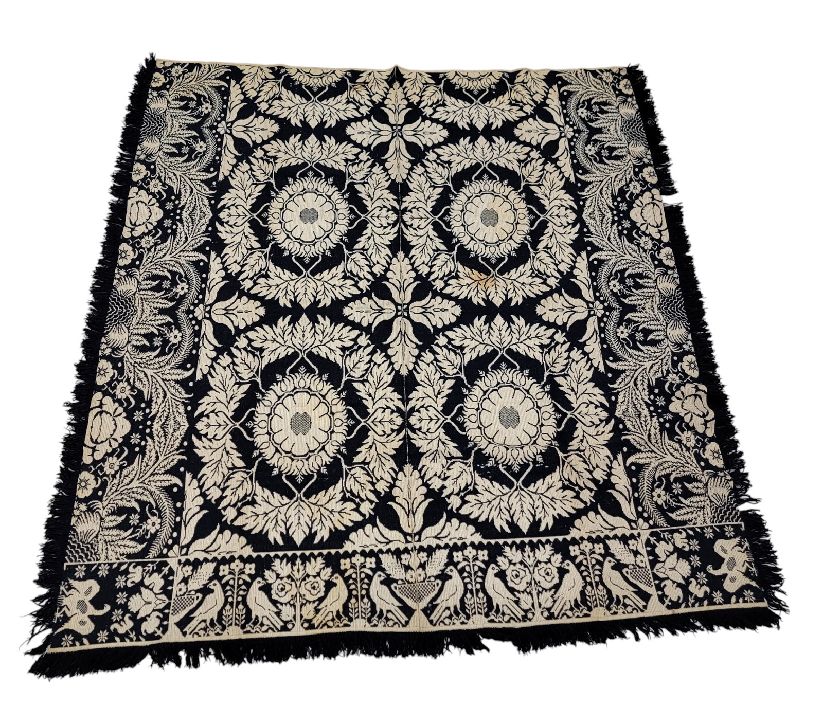 JACQUARD COVERLET: American, mid-19th century. Dark blue and white, with birds and wreaths. 86" by 80". Provenance: a Gallipolis, Ohio collection.