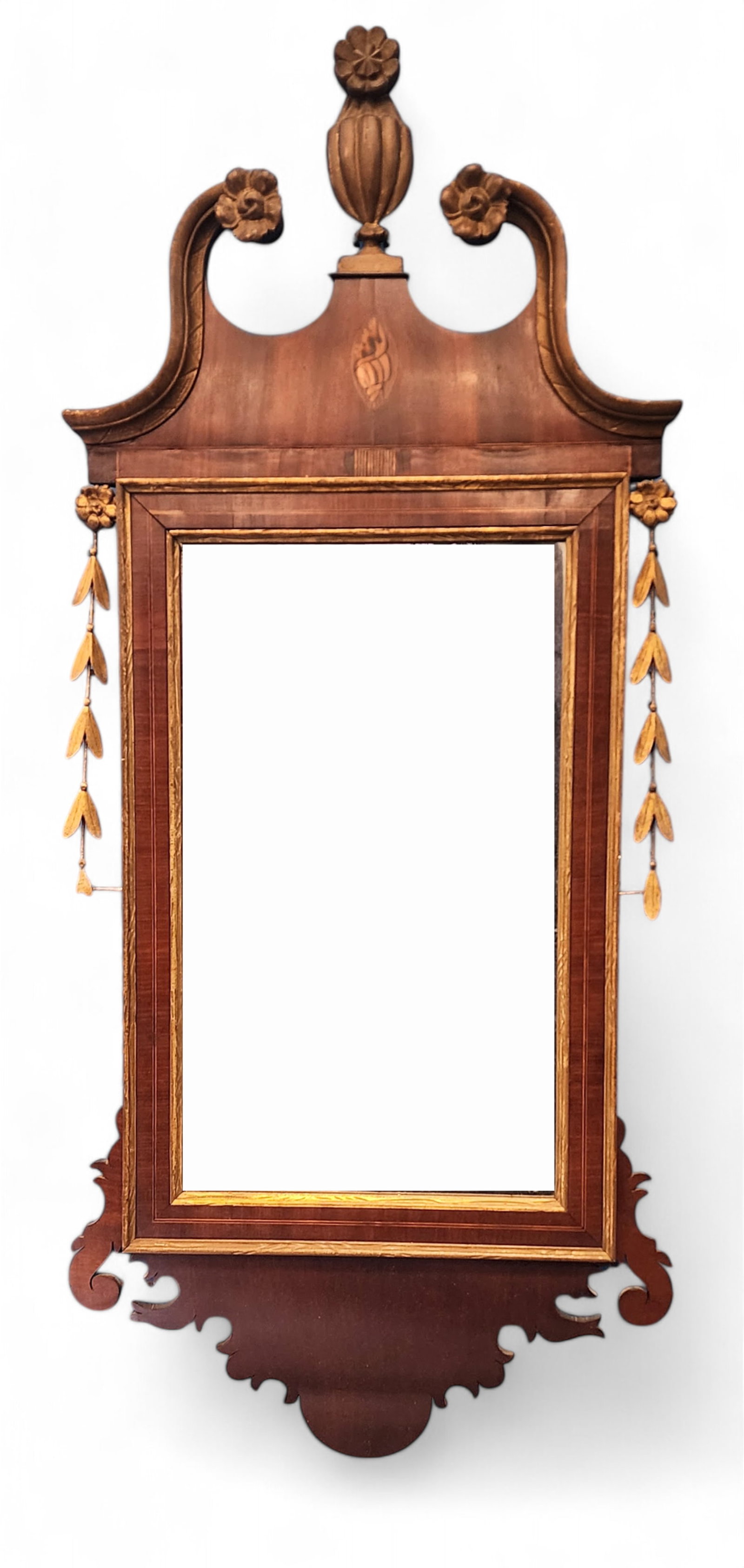 INLAID CHIPPENDALE MIRROR: American or English, early 19th century, mahogany. Scroll-cut mirror with shell inlay, urn finial, and side ornaments. 47" high, 20.5" wide. Provenance: a Gallipolis, Ohio collection.