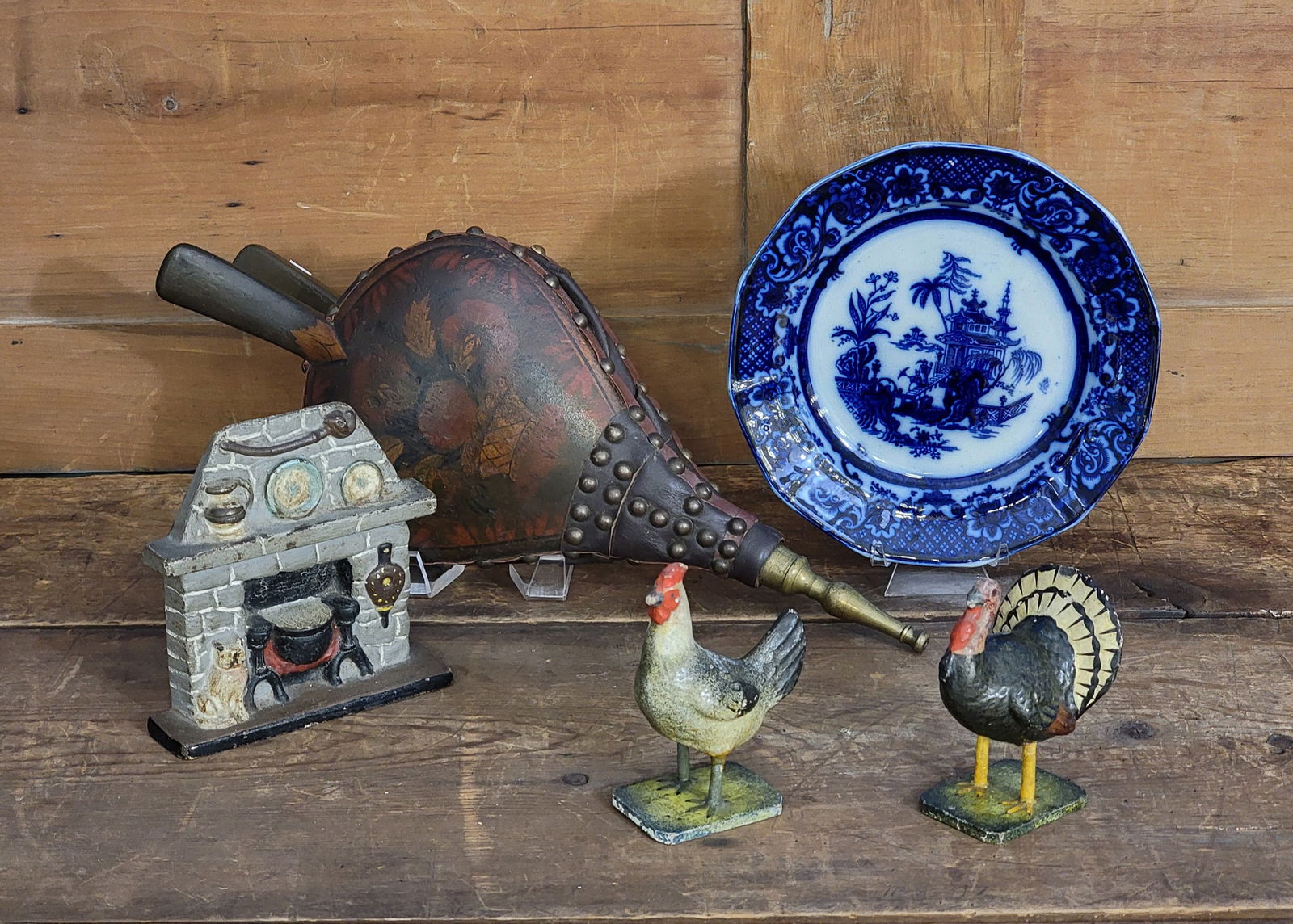 COLLECTION OF SMALL AMERICANA: 19th-early 20th century. Includes a bellows with original stencil decoration, 17.5" long; a flow blue plate by John Meir, 8.5" diameter; cast iron doorstop in the form of a hearth with cat (possibly N