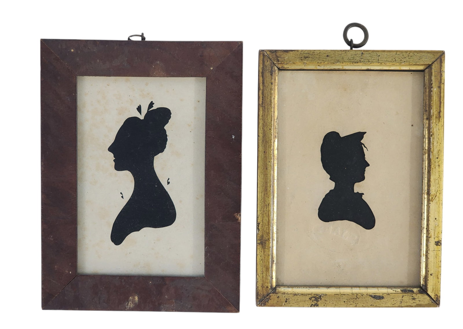 TWO PEALE'S MUSEUM SILHOUETTES: Philadelphia, early 19th century. Hollowcut silhouettes of ladies, each with impressed Peale Museum stamp. In period frames. 7.25" high, 5" wide and 7.5" high, 5.5" wide (overall).