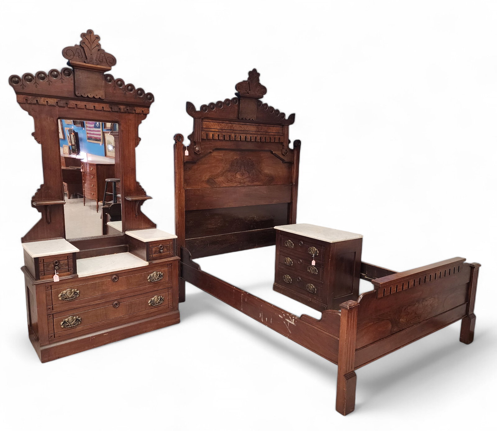 VICTORIAN BEDROOM SET: American, 1870s, walnut. Includes a drop-front dresser and washstand, both with marble tops, and a bed. The drawers are constructed with Knapp joints. Retains an old finish. Drop-front dresser is 88.5