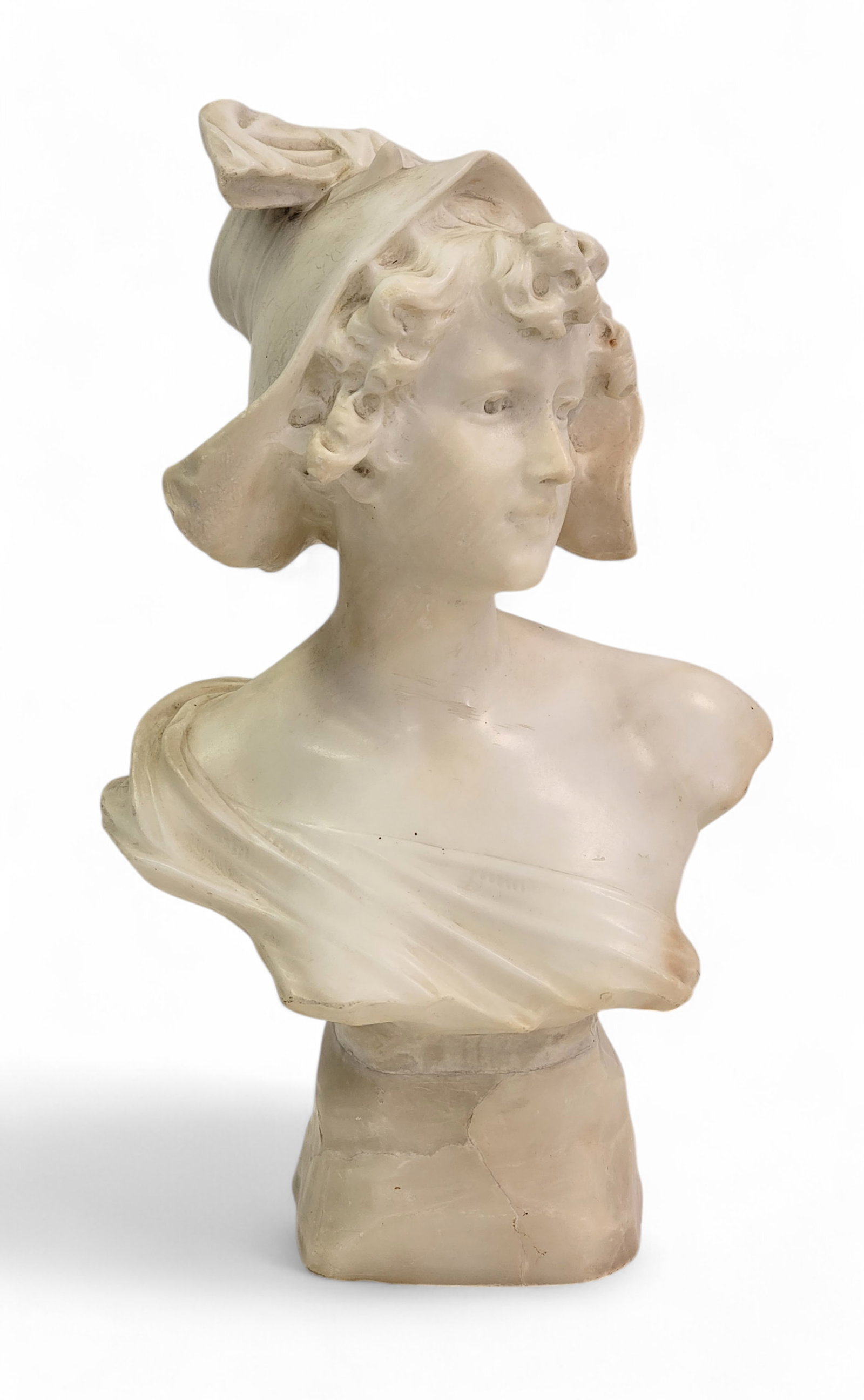 ALABASTER BUST: European, late 19th-early 20th century. Bust of a young lady wearing a bonnet with a large bow. 15" high. Provenance: From the collection of the late Pete Slates, Carrollton, Ohio.