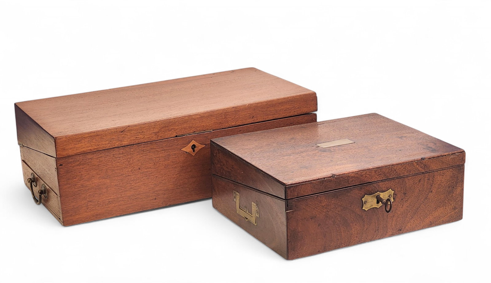 TWO ENGLISH LAP DESKS: 19th century, mahogany. One with recessed brass handles, and one with a locking side drawer. 12" and 17.5" wide. Provenance: a Gallipolis, Ohio collection.
