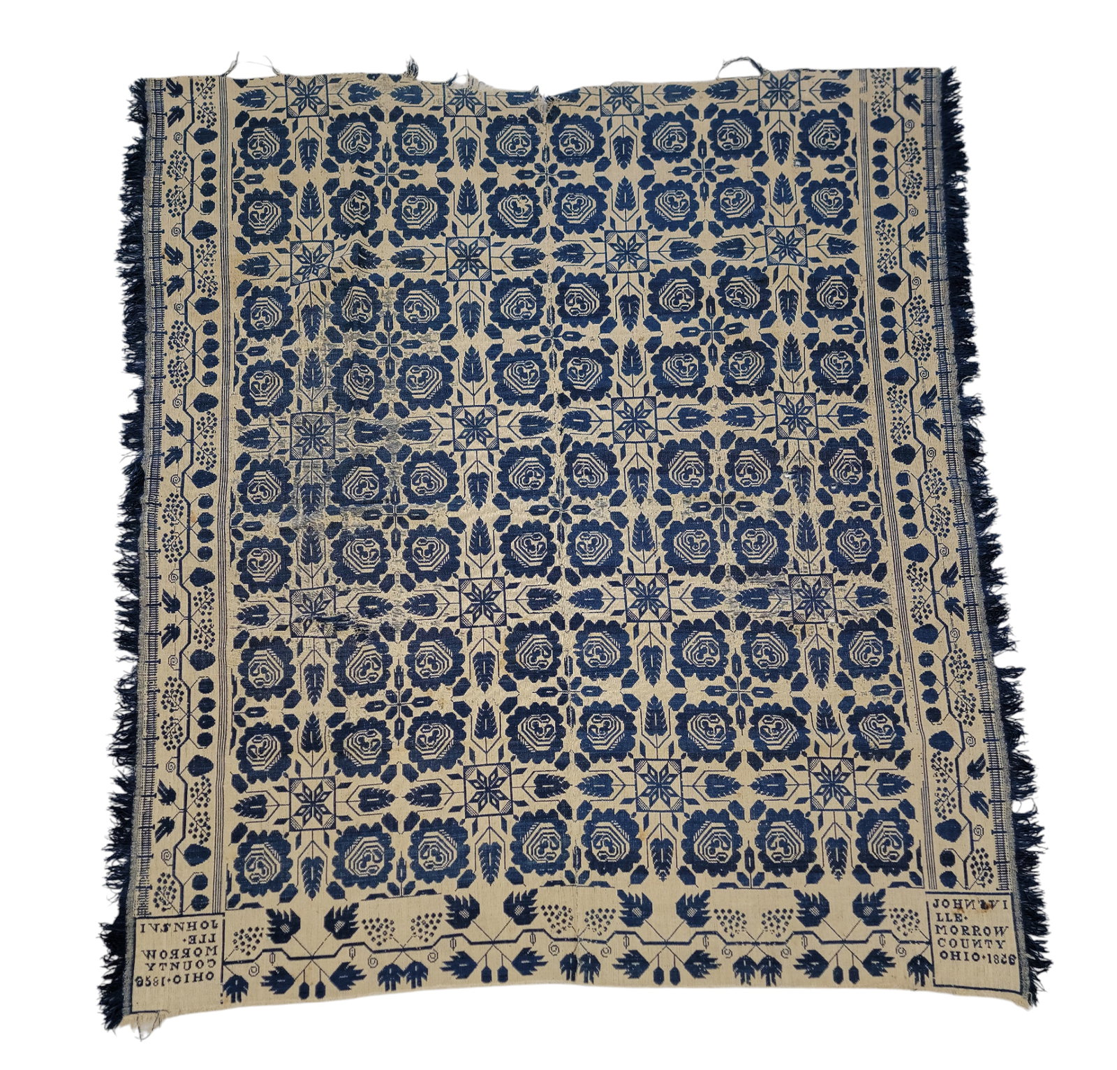JOHNSVILLE, OHIO COVERLET: Morrow County, Ohio, 1858. A two-piece coverlet woven in blue and natural, grapevine borders on three sides, the longer side borders with a fence, centerfield of rose medallions, corner blocks "JOHNSV