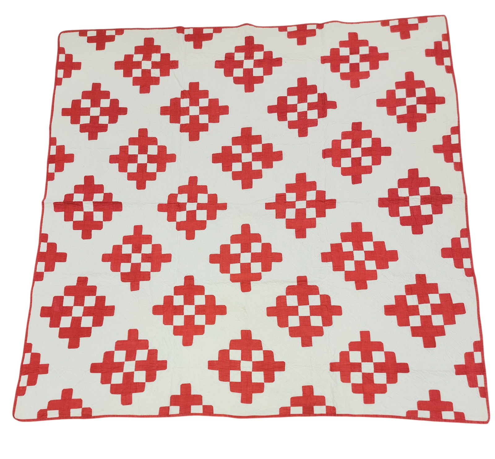 PIECED QUILT: American, mid-19th century, cotton. A pieced quilt with red crosses forming diamonds with red binding, 88" by 87". Provenance: The Dr. Virginia Gunn Collection, Wooster, Ohio.