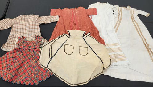 GROUP OF CHILDREN'S CLOTHING IN BROWNS AND REDS