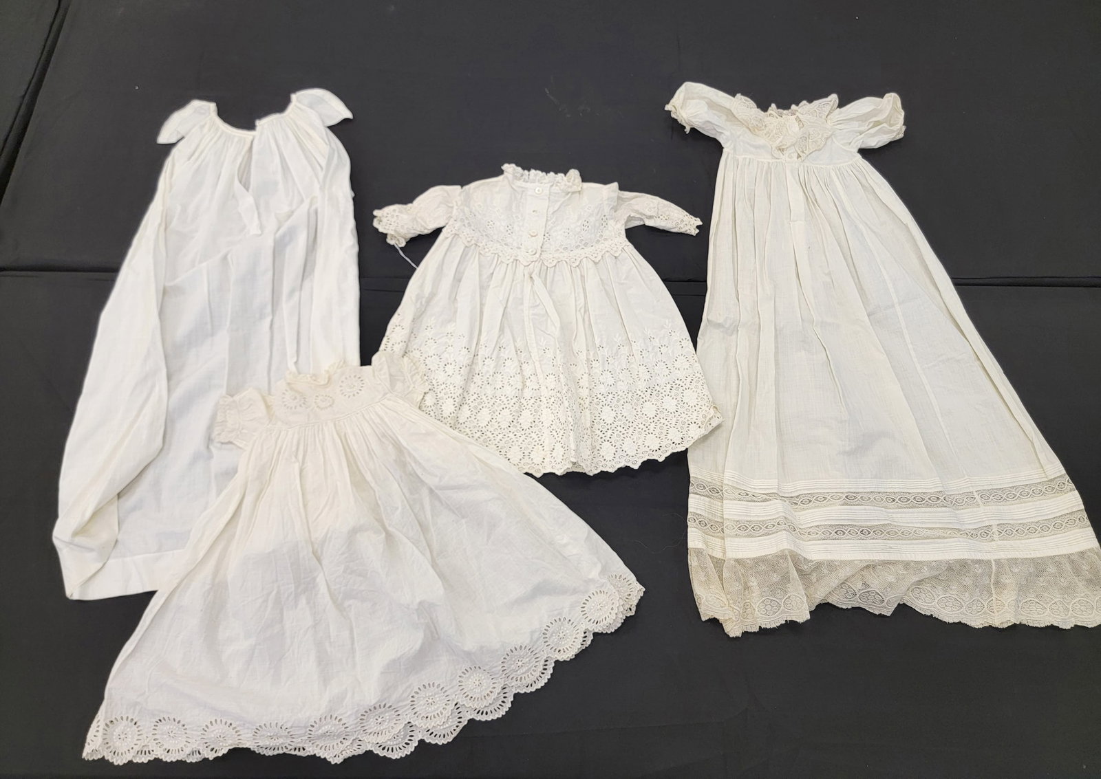 GROUP OF CHILDREN'S WHITE CLOTHING: American, late 19th-early 20th century. Four pieces. Gown with lace collar and skirt trim is 36" long. Provenance: The Dr. Virginia Gunn Collection, Wooster, Ohio