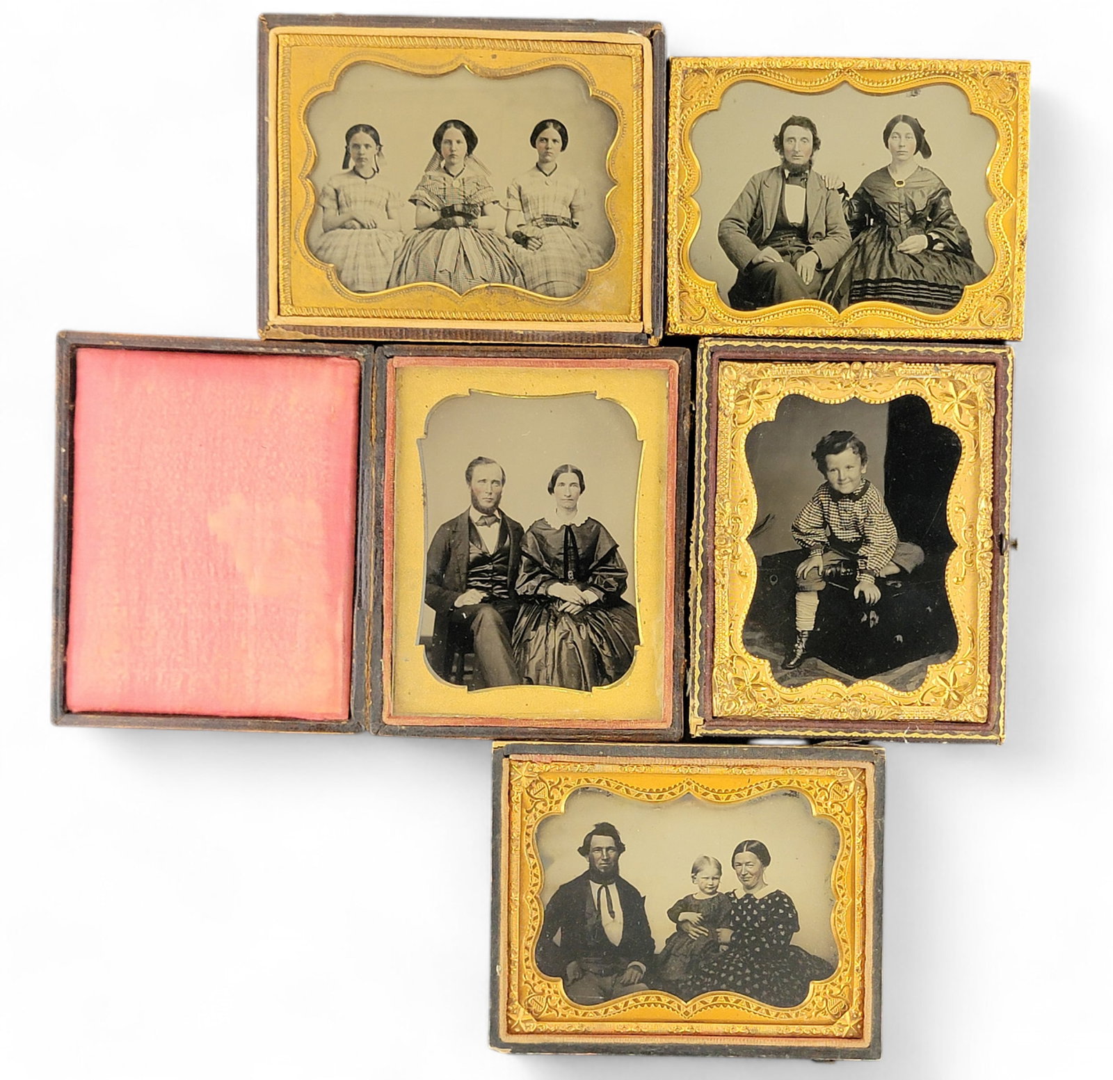 FIVE QUARTER PLATE PHOTOGRAPHS OF FAMILIES AND CHILDREN: 3rd quarter-19th century. Includes a tintype of a mother, father, and child, and ambrotypes of sisters, a child, and two couples. Provenance: The Virginia Gunn Collection, Wooster, Ohio.