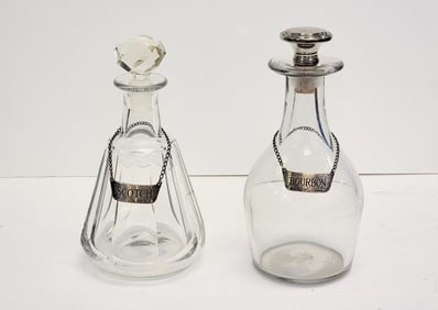 TWO DECANTERS WITH BOTTLE TAGS