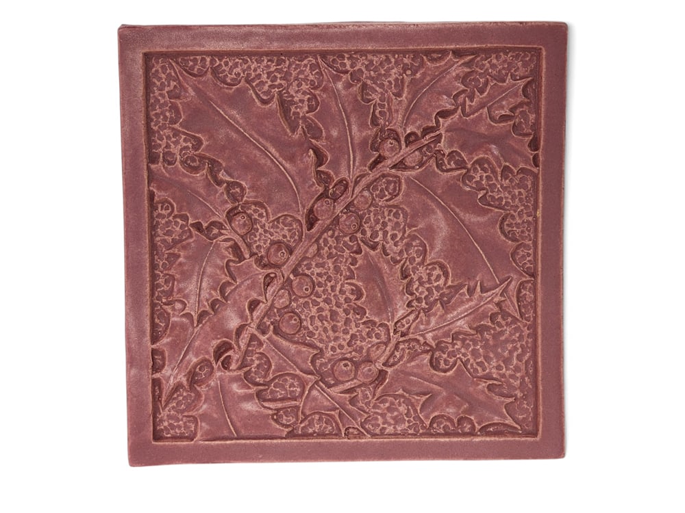 FULPER HOLLY TRIVET: Flemington, New Jersey, c. 1995. Clay tile with pink glaze, 4th in the series, with original box and paperwork, 8" square. Provenance: Denker Collection, Delaware and North Carolina. PLEASE NOTE: YOU
