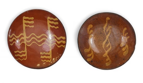 TWO SLIP-DECORATED REDWARE PLATES