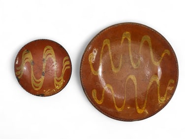 TWO SLIP-DECORATED REDWARE PLATES