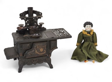 TOY STOVE AND CHINA HEAD DOLL