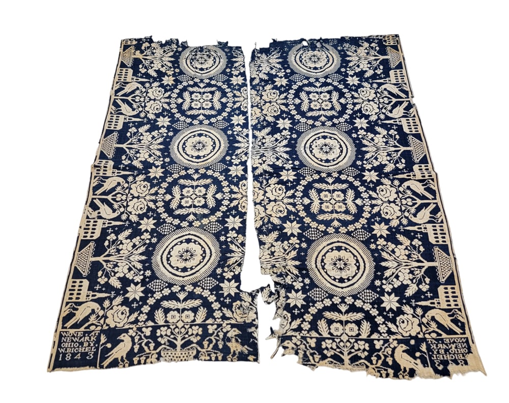 NEWARK (LICKING COUNTY), OHIO COVERLET: W. Bichel, Licking County, Ohio, 1843. A dark blue jacquard woven coverlet in two separate panels with rose and foliate medallions, borders with a steepled church , a basket of flowers, and bird and t