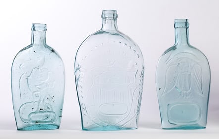 THREE HISTORICAL GLASS FLASKS