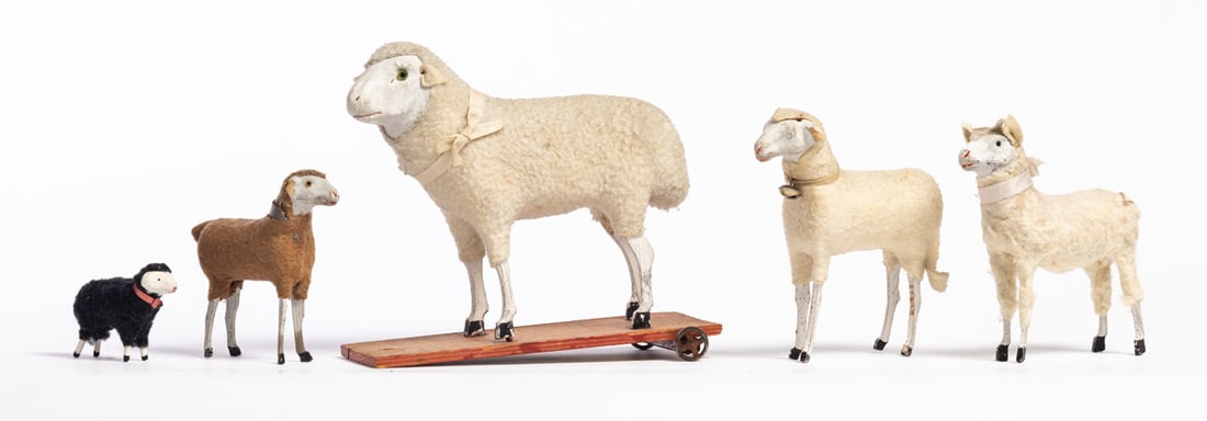 FIVE PUTZ SHEEP: German, late 19th-early 20th century. Includes one pull toy, two adults, and two lambs. 1.5" to 6.5" high. Provenance: the collection of the late Jo Louise Brown, Zoar, Ohio. In-house shipping is avai