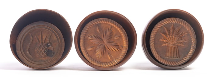 THREE CARVED BUTTER MOLDS
