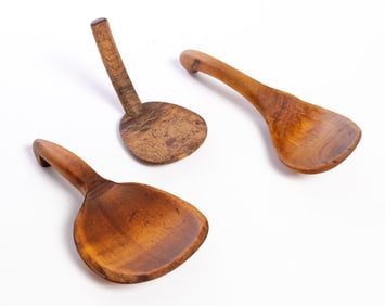 THREE CARVED BUTTER PADDLES