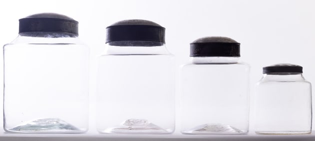 FOUR GLASS CANISTERS