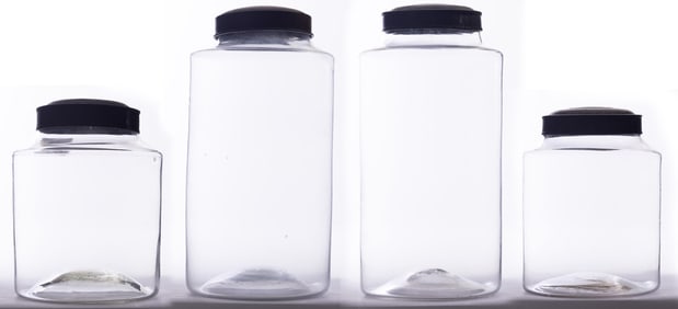 FOUR GLASS CANISTERS