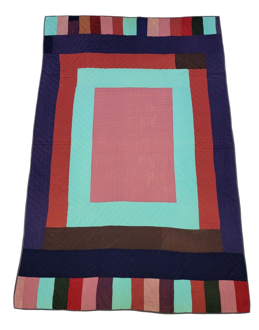 AMISH QUILT: Attributed to Garnett, Kansas, 20th century, cotton. A pieced quilt in solid blue, black, red, and turquoise, with red backing. 76" by 52.5". Provenance: The Virginia Gunn Collection, Wooster, Ohio. A
