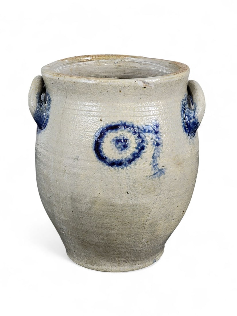 COBALT-DECORATED STONEWARE CROCK: Possibly New York, mid-late 19th century. Ovoid form with lightly tooled shoulder and foot, applied loop handles. Cobalt brushed handles and unidentified design - possibly flower or stylized "watchspr