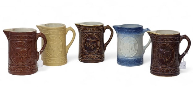 FIVE MOLDED PITCHERS WITH "GRAZING COWS"