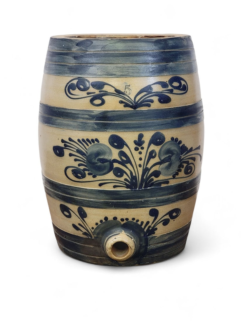 COBALT-DECORATED STONEWARE COOLER: Attributed to Barnabus Edmands, Charlestown, Massachusetts, c. 1860. Five-gallon, slightly ovoid form, with raised bands, and with elaborate cobalt floral decoration. 16" high. For two similar churns,