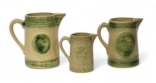 THREE MOLDED PITCHERS WITH "GRAZING COWS"